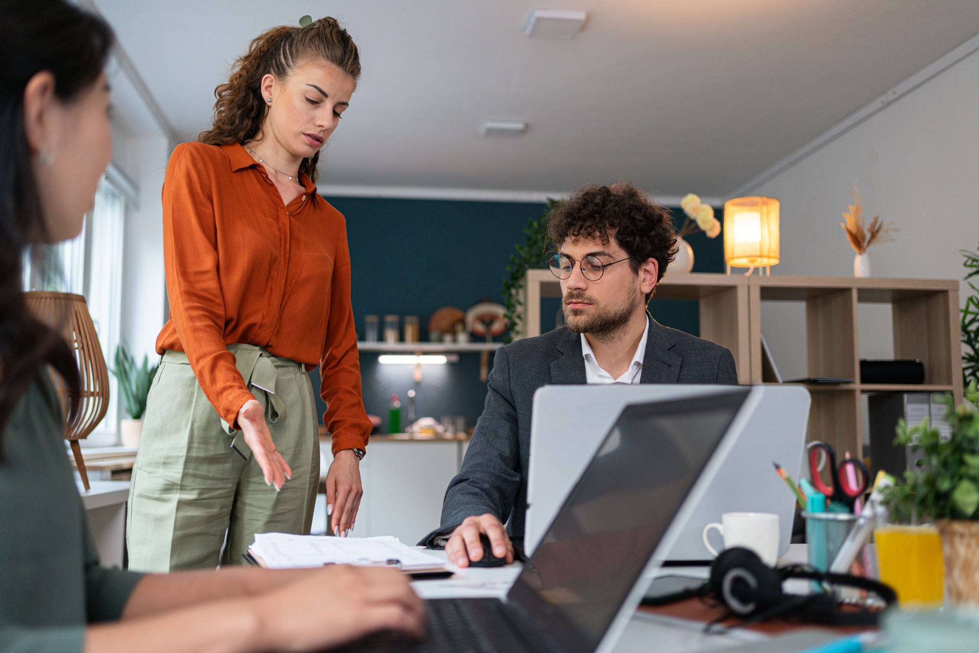 Female manager, having a consultation with multiracial coworkers at the office