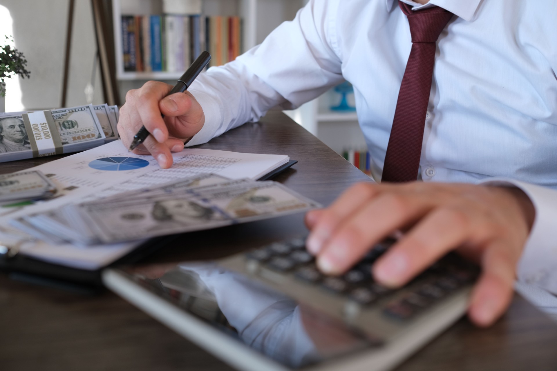 Businessman using calculator